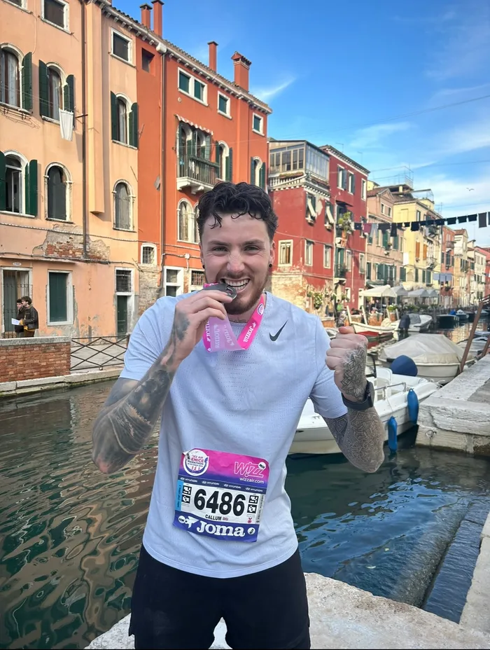 Callum with his Venice Marathon finisher's medal